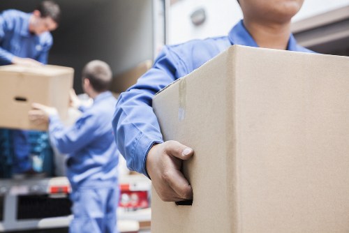 Moving team helping with a London home removal on a residential street
