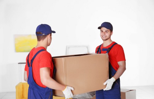 Person using a laptop to access a Movers London website page