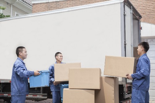 Professional movers loading boxes in London for a home relocation