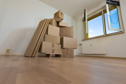Packed office boxes and furniture ready for transport