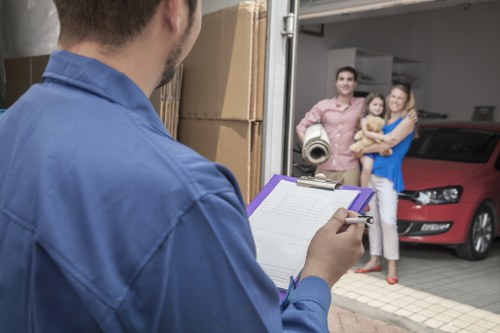 Professional packers preparing boxes for a London home move