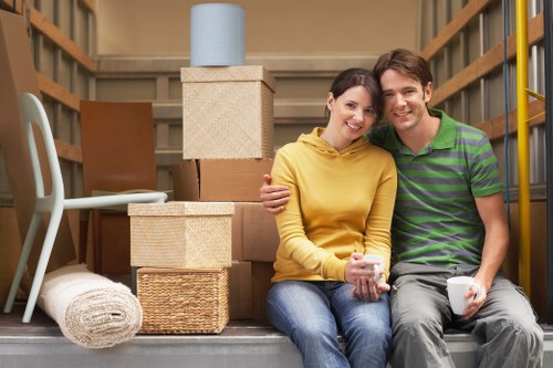 Moving team handling boxes and furniture in London for a home relocation