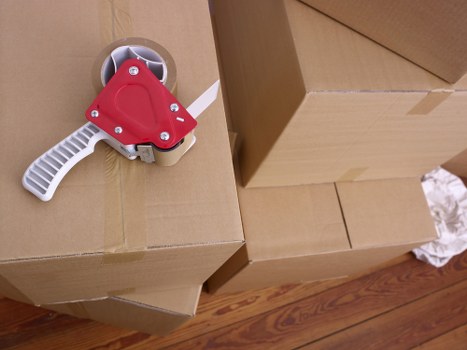 Professional movers navigating a flat move in London