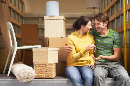 Local furniture pick-up service loading items from a residential building