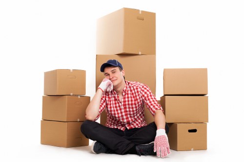 London moving team organizing packed household items before transport