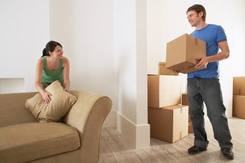 Experienced movers handling furniture during a city relocation in London